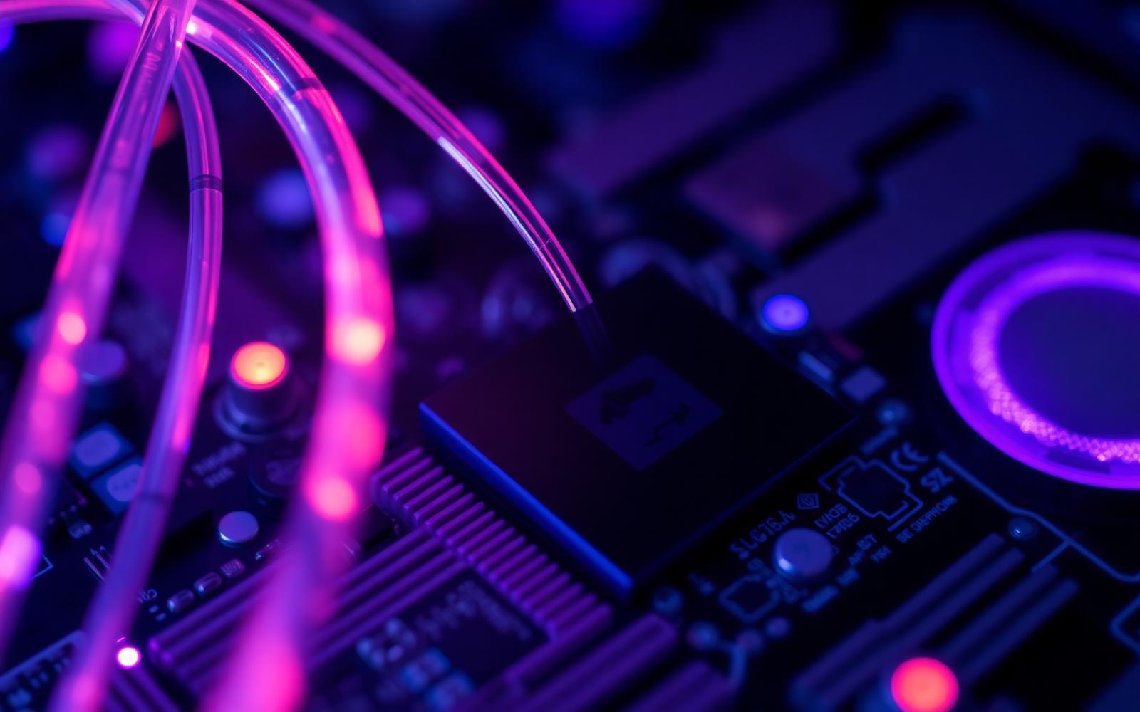 Fibre-optic cables merging into a circuit board representing Odoo integration